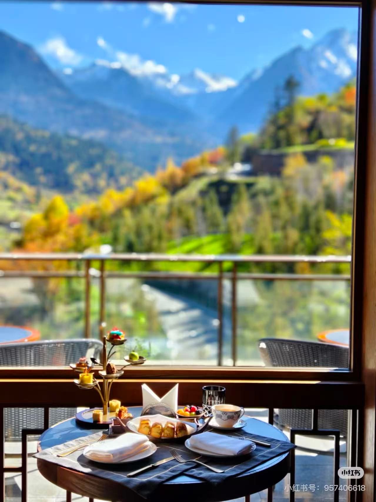 Afternoon tea with panoramic autumn mountain view and snow peaks from a luxury hotel. - ChinaTripTop.